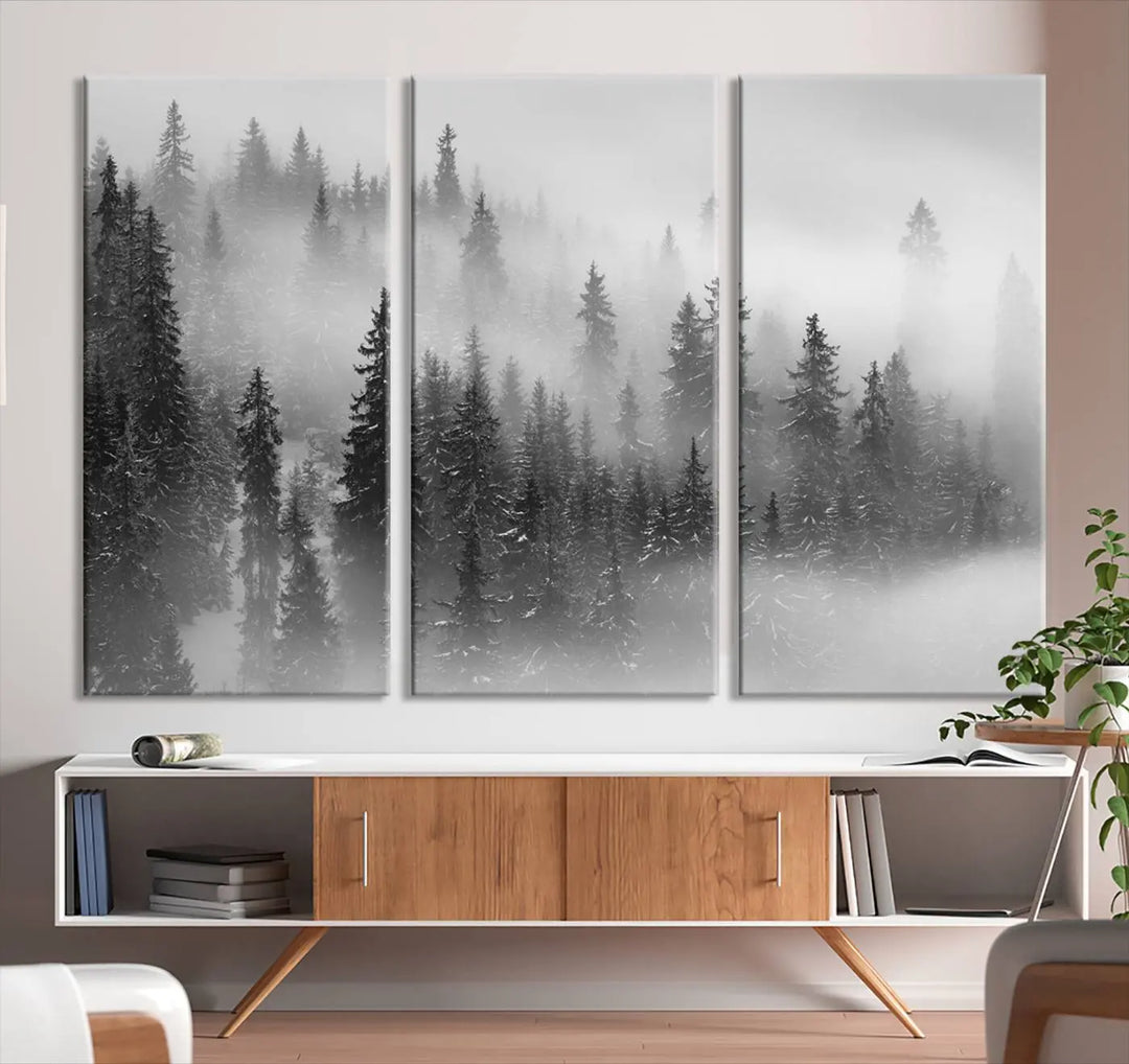 The living room showcases the Foggy Misty Forest Canvas Wall Art in black and white, presented as a triptych on the wall.