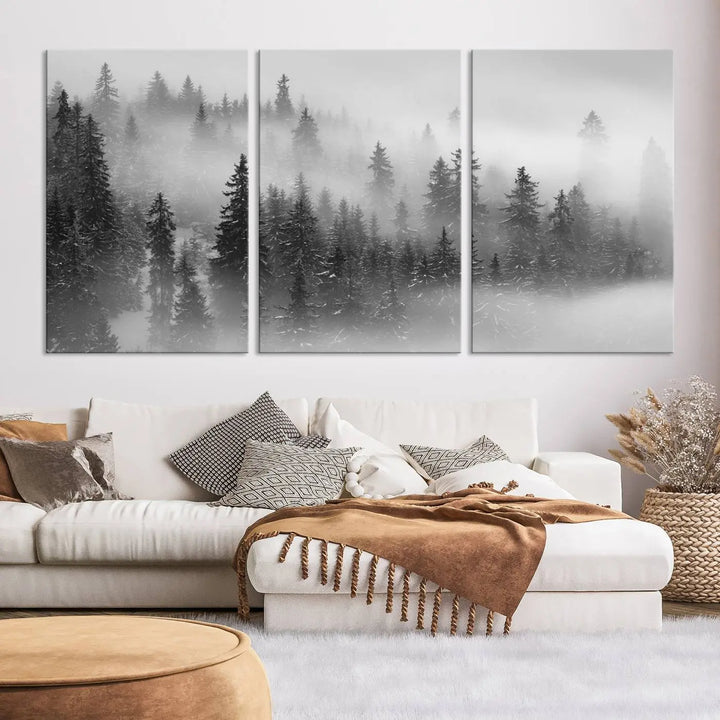 The living room showcases the Foggy Misty Forest Canvas Wall Art in black and white, presented as a triptych on the wall.