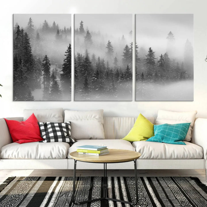 The living room showcases the Foggy Misty Forest Canvas Wall Art in black and white, presented as a triptych on the wall.