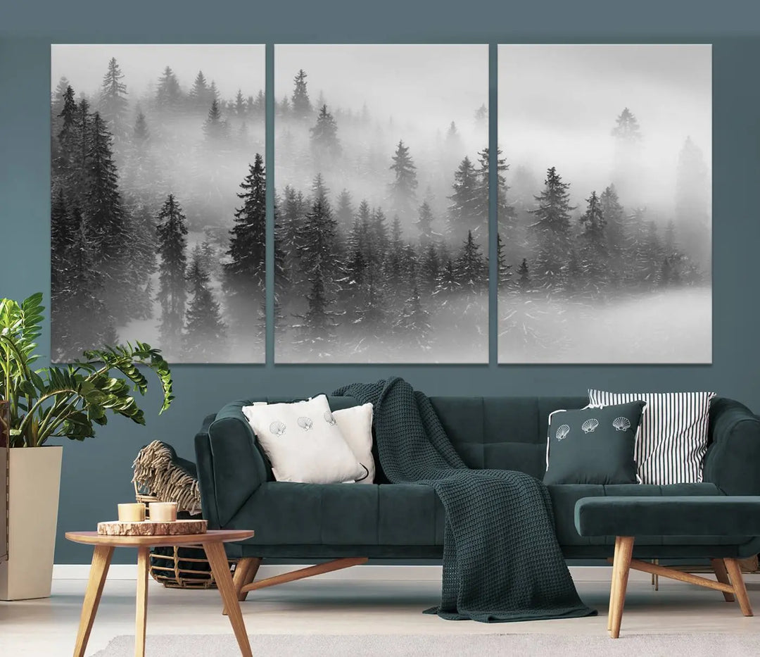 The living room showcases the Foggy Misty Forest Canvas Wall Art in black and white, presented as a triptych on the wall.