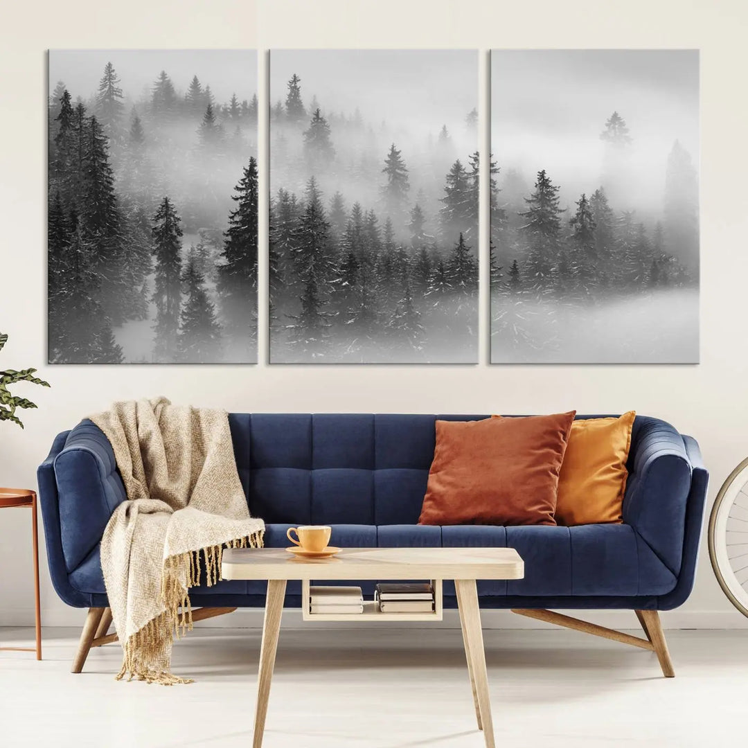 The living room showcases the Foggy Misty Forest Canvas Wall Art in black and white, presented as a triptych on the wall.