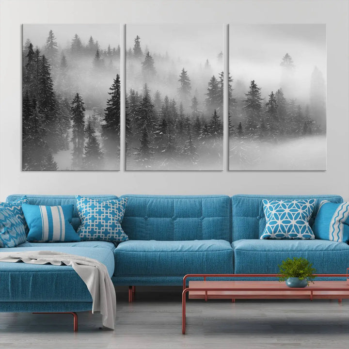 The living room showcases the Foggy Misty Forest Canvas Wall Art in black and white, presented as a triptych on the wall.