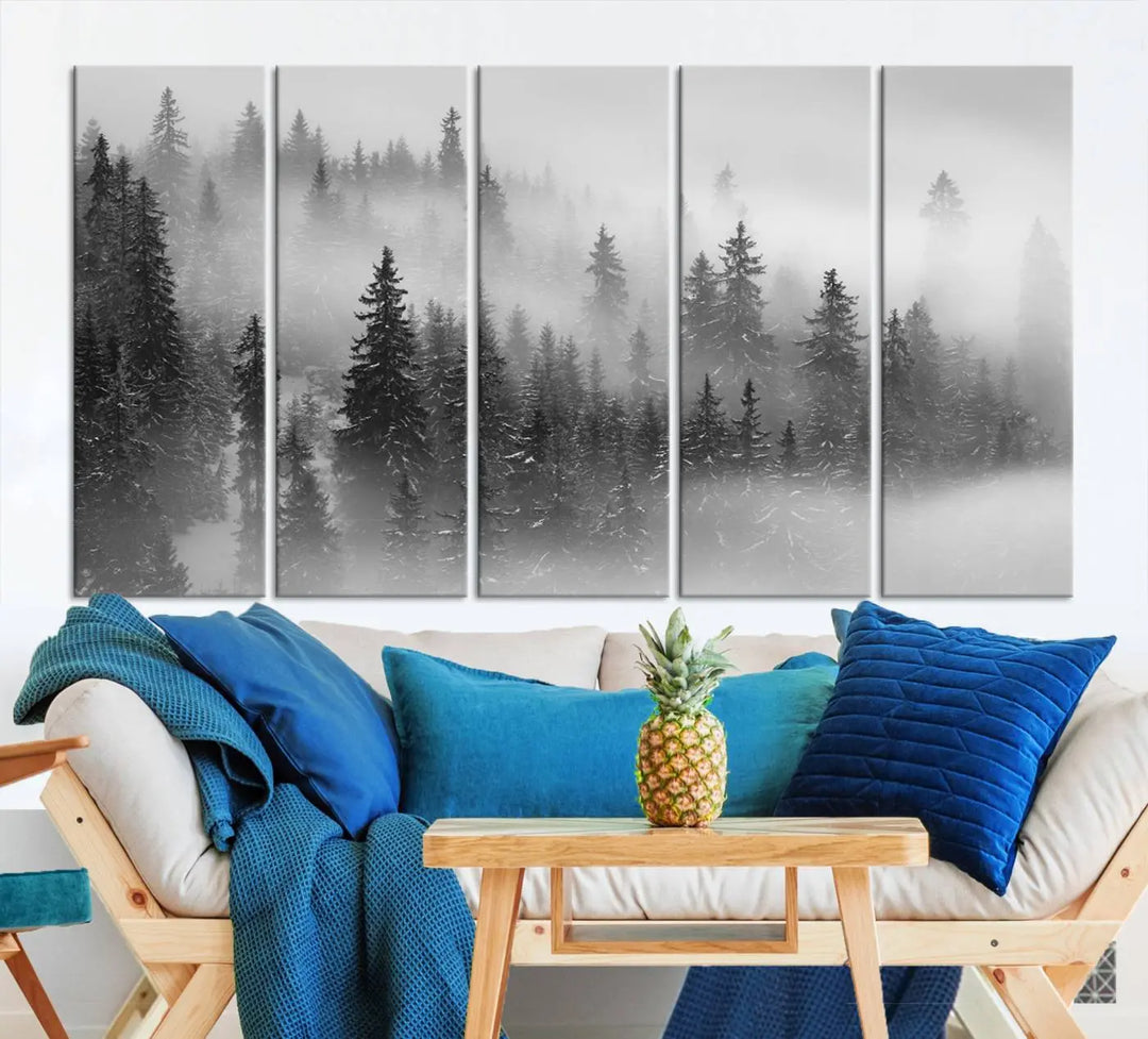 The living room showcases the Foggy Misty Forest Canvas Wall Art in black and white, presented as a triptych on the wall.