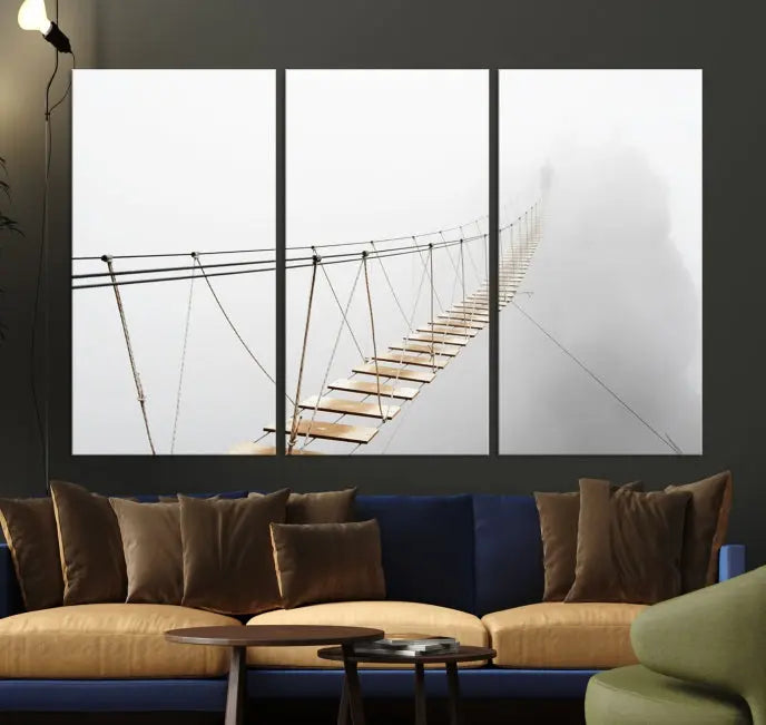 The Foggy and Wood Bridge Wall Art Canvas Print, with its UV-protective coating, elegantly adorns the living room wall. This museum-quality canvas depicting a foggy skywalk bridge exudes a captivating allure that remains timeless.