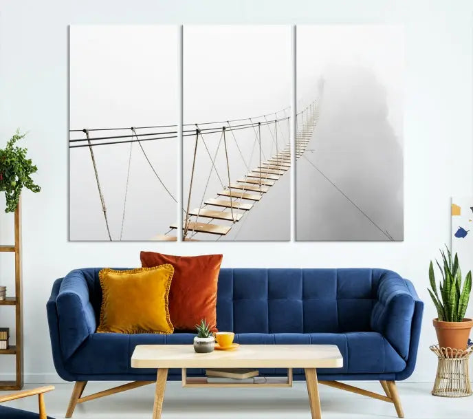 The Foggy and Wood Bridge Wall Art Canvas Print, with its UV-protective coating, elegantly adorns the living room wall. This museum-quality canvas depicting a foggy skywalk bridge exudes a captivating allure that remains timeless.