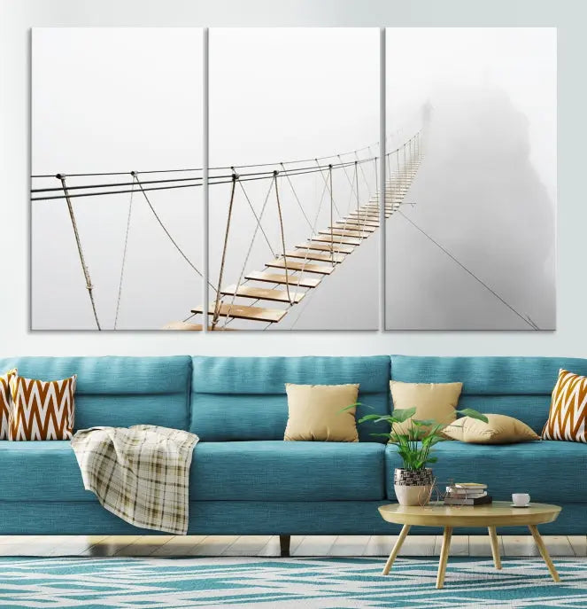 The Foggy and Wood Bridge Wall Art Canvas Print, with its UV-protective coating, elegantly adorns the living room wall. This museum-quality canvas depicting a foggy skywalk bridge exudes a captivating allure that remains timeless.