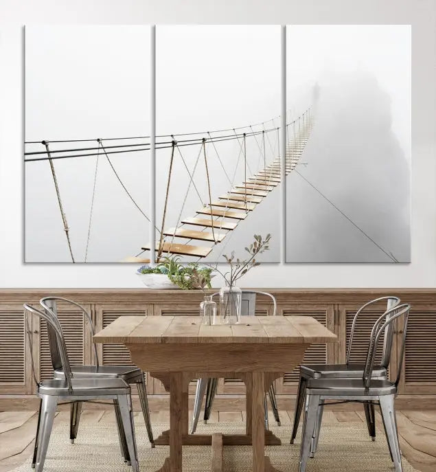 The Foggy and Wood Bridge Wall Art Canvas Print, with its UV-protective coating, elegantly adorns the living room wall. This museum-quality canvas depicting a foggy skywalk bridge exudes a captivating allure that remains timeless.