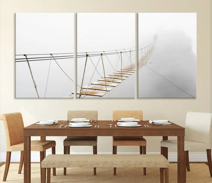 The Foggy and Wood Bridge Wall Art Canvas Print, with its UV-protective coating, elegantly adorns the living room wall. This museum-quality canvas depicting a foggy skywalk bridge exudes a captivating allure that remains timeless.