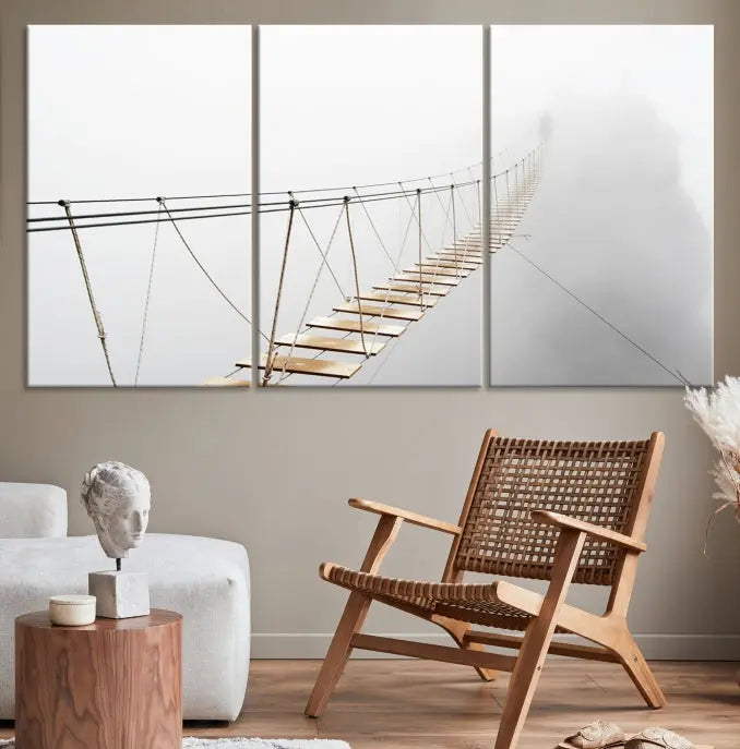 The Foggy and Wood Bridge Wall Art Canvas Print, with its UV-protective coating, elegantly adorns the living room wall. This museum-quality canvas depicting a foggy skywalk bridge exudes a captivating allure that remains timeless.