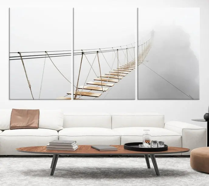 The Foggy and Wood Bridge Wall Art Canvas Print, with its UV-protective coating, elegantly adorns the living room wall. This museum-quality canvas depicting a foggy skywalk bridge exudes a captivating allure that remains timeless.