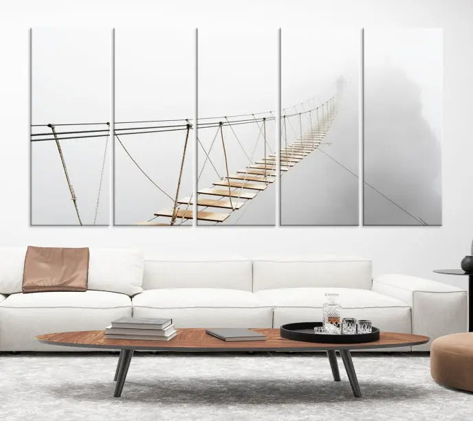 The Foggy and Wood Bridge Wall Art Canvas Print, with its UV-protective coating, elegantly adorns the living room wall. This museum-quality canvas depicting a foggy skywalk bridge exudes a captivating allure that remains timeless.