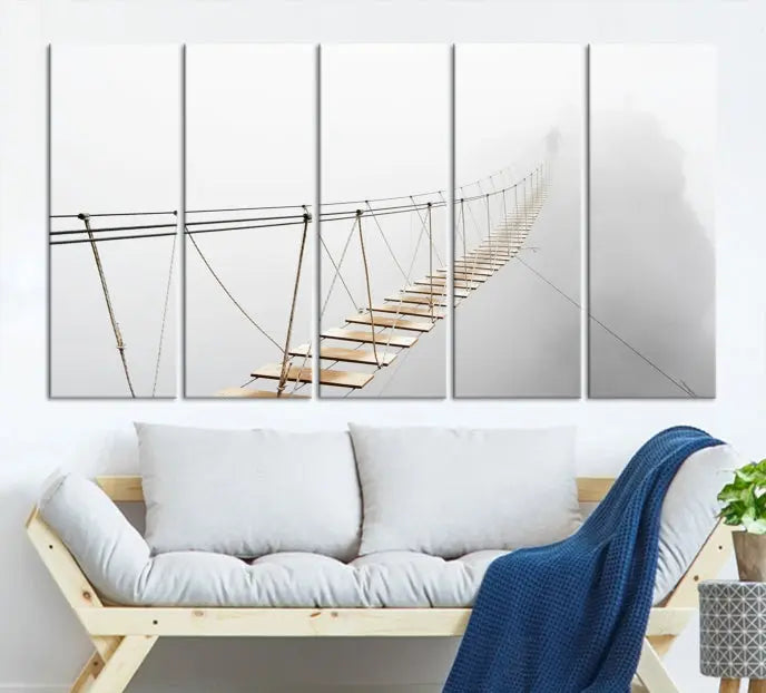 The Foggy and Wood Bridge Wall Art Canvas Print, with its UV-protective coating, elegantly adorns the living room wall. This museum-quality canvas depicting a foggy skywalk bridge exudes a captivating allure that remains timeless.