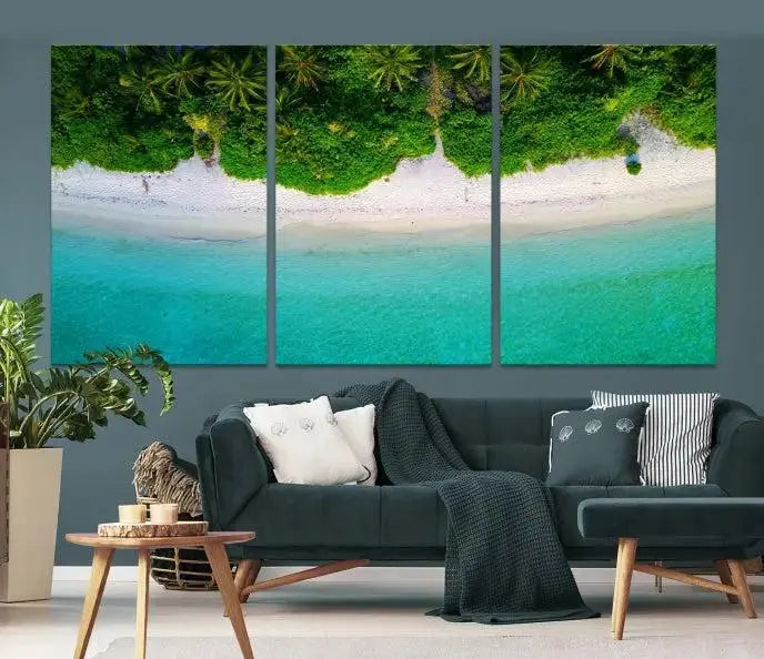 The Forest and Aerial Ocean Wall Art Canvas Print depicts a tropical beach scene, showcasing turquoise waters, white sand, and lush green trees. This triptych is gallery wrapped on museum-quality canvas and features a UV-protective coating to maintain its vibrant colors.