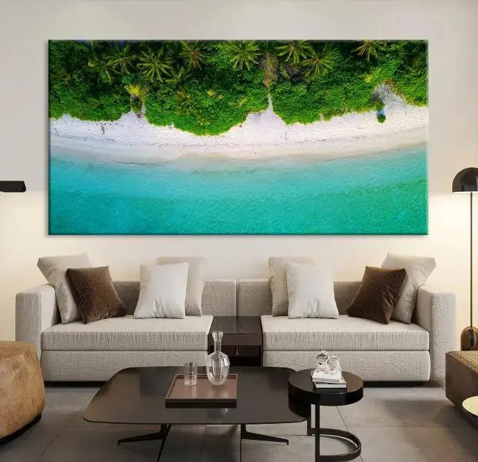 The Forest and Aerial Ocean Wall Art Canvas Print depicts a tropical beach scene, showcasing turquoise waters, white sand, and lush green trees. This triptych is gallery wrapped on museum-quality canvas and features a UV-protective coating to maintain its vibrant colors.