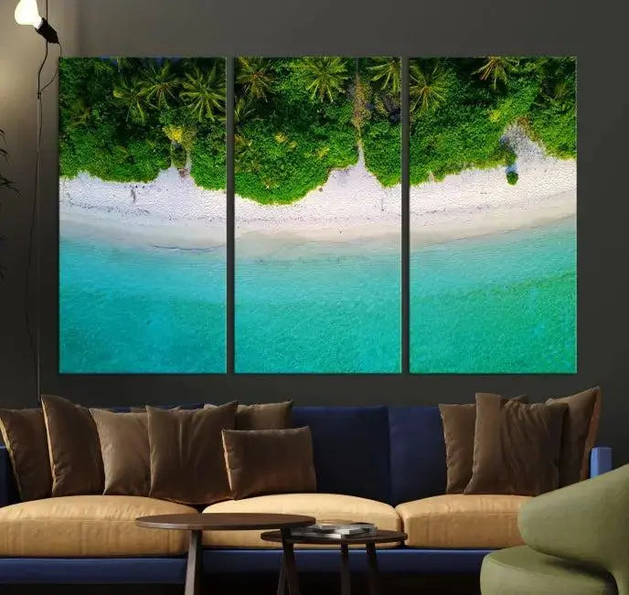 The Forest and Aerial Ocean Wall Art Canvas Print depicts a tropical beach scene, showcasing turquoise waters, white sand, and lush green trees. This triptych is gallery wrapped on museum-quality canvas and features a UV-protective coating to maintain its vibrant colors.