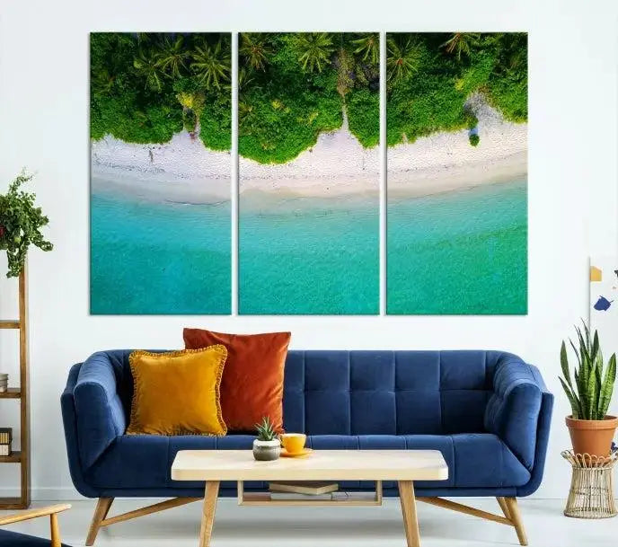 The Forest and Aerial Ocean Wall Art Canvas Print depicts a tropical beach scene, showcasing turquoise waters, white sand, and lush green trees. This triptych is gallery wrapped on museum-quality canvas and features a UV-protective coating to maintain its vibrant colors.