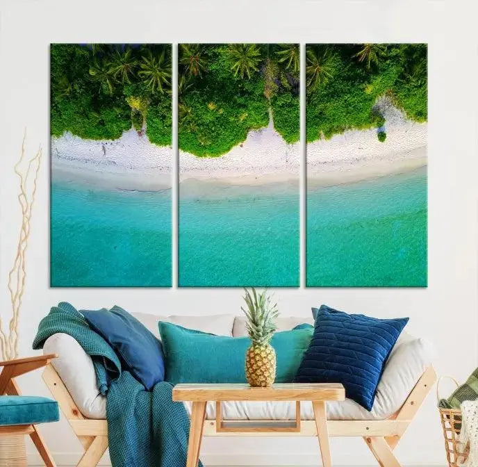 The Forest and Aerial Ocean Wall Art Canvas Print depicts a tropical beach scene, showcasing turquoise waters, white sand, and lush green trees. This triptych is gallery wrapped on museum-quality canvas and features a UV-protective coating to maintain its vibrant colors.