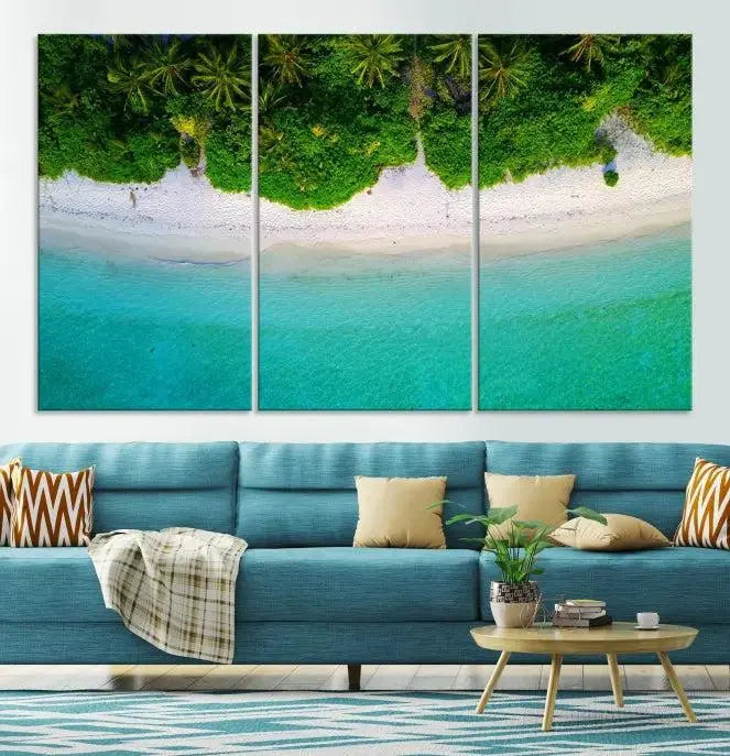 The Forest and Aerial Ocean Wall Art Canvas Print depicts a tropical beach scene, showcasing turquoise waters, white sand, and lush green trees. This triptych is gallery wrapped on museum-quality canvas and features a UV-protective coating to maintain its vibrant colors.