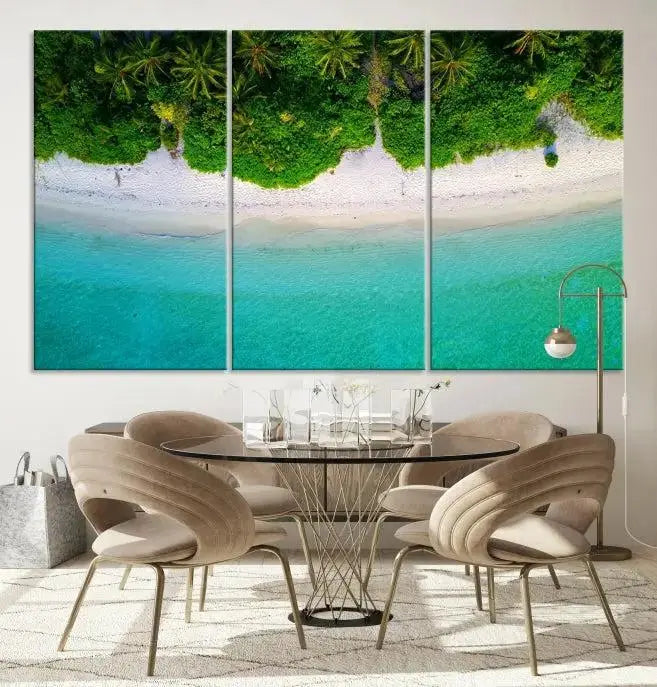 The Forest and Aerial Ocean Wall Art Canvas Print depicts a tropical beach scene, showcasing turquoise waters, white sand, and lush green trees. This triptych is gallery wrapped on museum-quality canvas and features a UV-protective coating to maintain its vibrant colors.