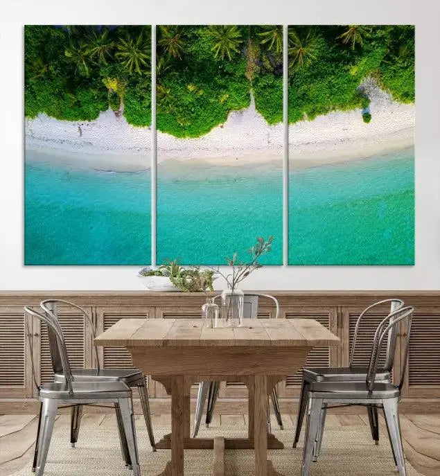 The Forest and Aerial Ocean Wall Art Canvas Print depicts a tropical beach scene, showcasing turquoise waters, white sand, and lush green trees. This triptych is gallery wrapped on museum-quality canvas and features a UV-protective coating to maintain its vibrant colors.