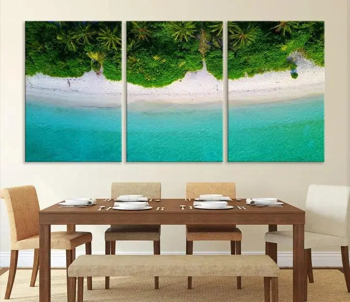 The Forest and Aerial Ocean Wall Art Canvas Print depicts a tropical beach scene, showcasing turquoise waters, white sand, and lush green trees. This triptych is gallery wrapped on museum-quality canvas and features a UV-protective coating to maintain its vibrant colors.