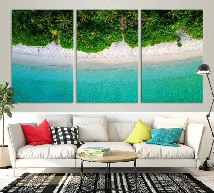 The Forest and Aerial Ocean Wall Art Canvas Print depicts a tropical beach scene, showcasing turquoise waters, white sand, and lush green trees. This triptych is gallery wrapped on museum-quality canvas and features a UV-protective coating to maintain its vibrant colors.