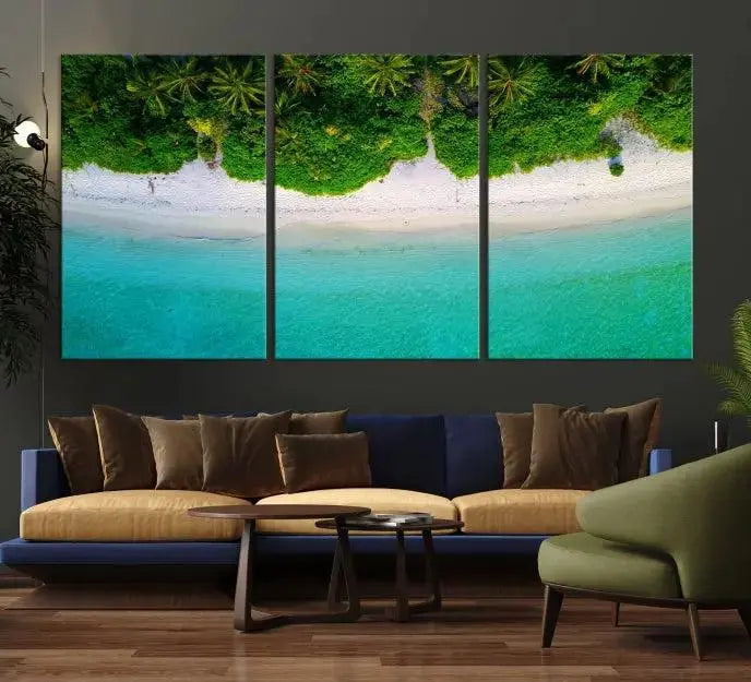 The Forest and Aerial Ocean Wall Art Canvas Print depicts a tropical beach scene, showcasing turquoise waters, white sand, and lush green trees. This triptych is gallery wrapped on museum-quality canvas and features a UV-protective coating to maintain its vibrant colors.