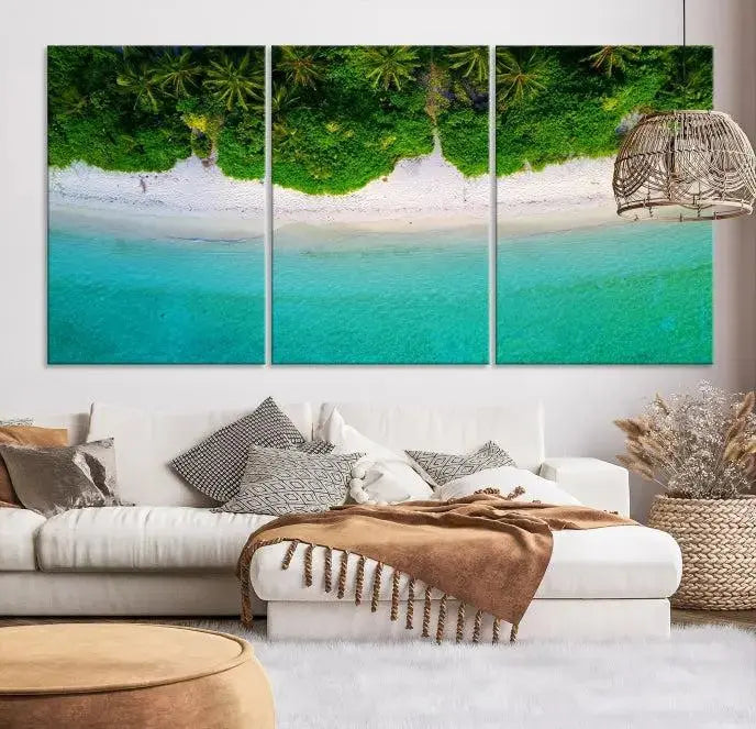 The Forest and Aerial Ocean Wall Art Canvas Print depicts a tropical beach scene, showcasing turquoise waters, white sand, and lush green trees. This triptych is gallery wrapped on museum-quality canvas and features a UV-protective coating to maintain its vibrant colors.