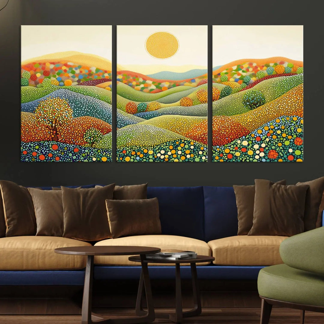 A framed Yayoi Kusama print featuring an abstract pointillism-inspired landscape of vibrant rolling hills and a sun.