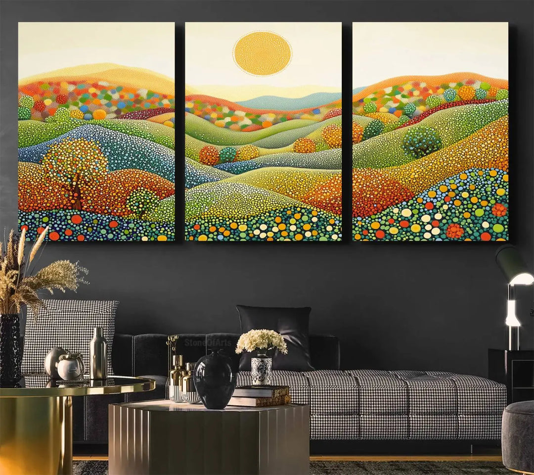 A framed Yayoi Kusama print featuring an abstract pointillism-inspired landscape of vibrant rolling hills and a sun.