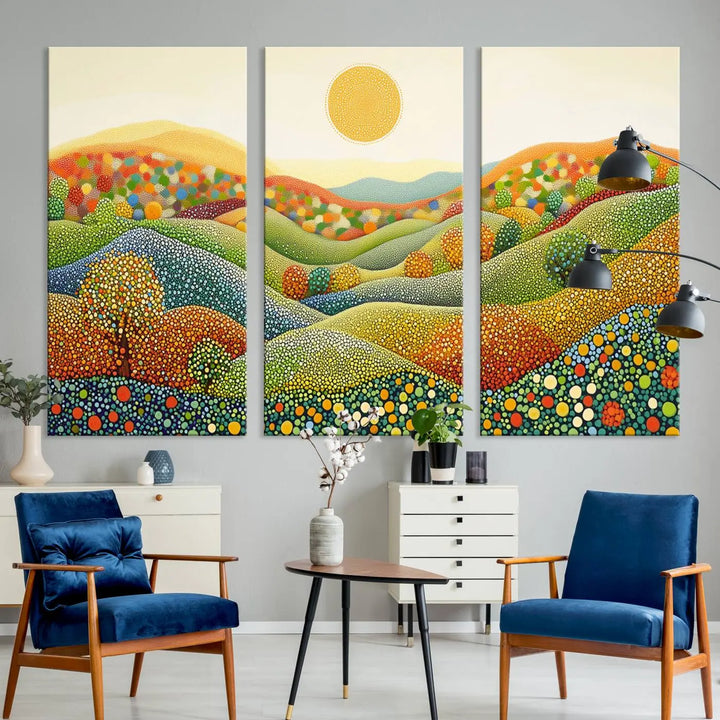 A framed Yayoi Kusama print featuring an abstract pointillism-inspired landscape of vibrant rolling hills and a sun.