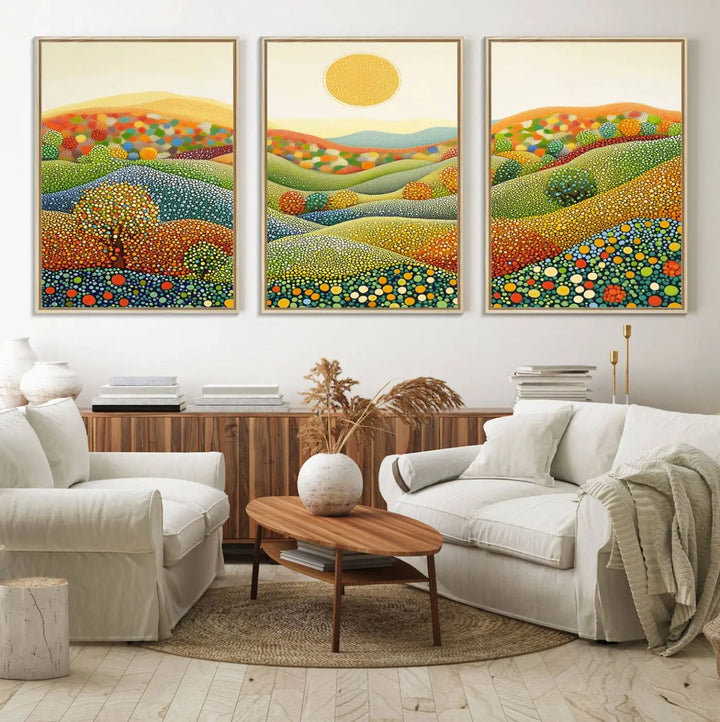 A framed Yayoi Kusama print featuring an abstract pointillism-inspired landscape of vibrant rolling hills and a sun.