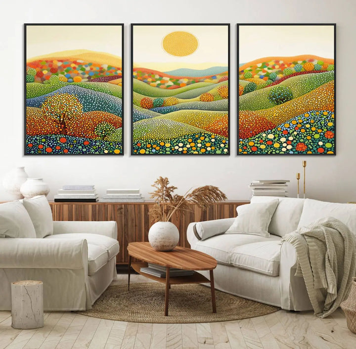 A framed Yayoi Kusama print featuring an abstract pointillism-inspired landscape of vibrant rolling hills and a sun.