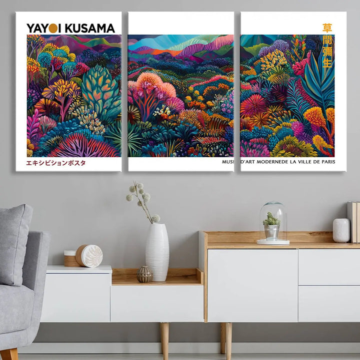 A set of three vibrant abstract landscape canvas prints, inspired by Yayoi Kusama's style and capturing a Japanese Wabi Sabi aesthetic, adorns the dark wall, creating a stunning piece of contemporary décor.