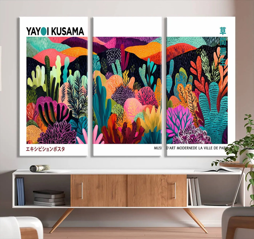 A cozy living room features colorful wall art, with the Framed Yayoi Kusama 1986 Wall Art Print taking center stage. This vibrant abstract landscape canvas seamlessly blends with the contemporary décor, creating a lively yet harmonious atmosphere.