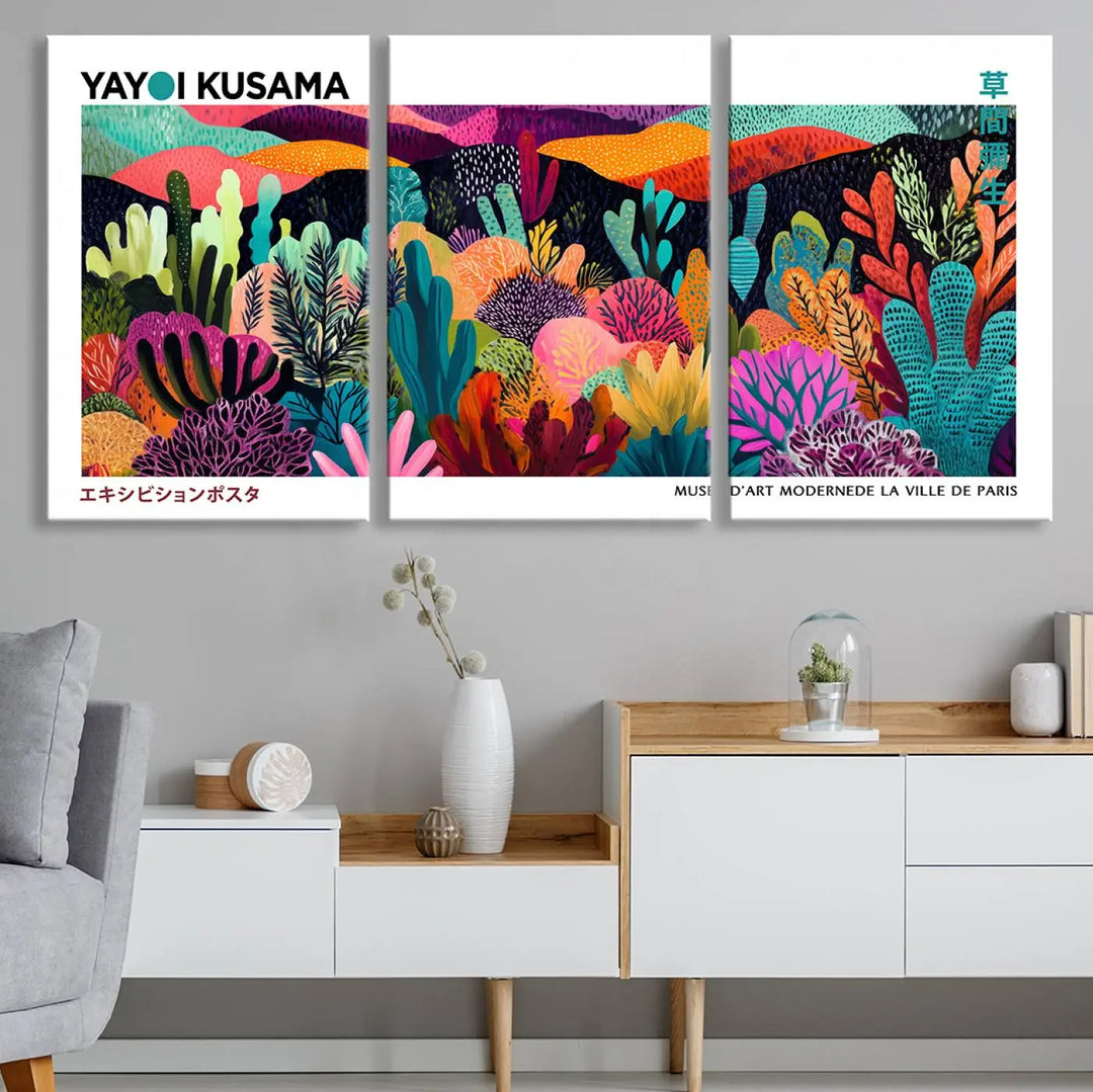 A cozy living room features colorful wall art, with the Framed Yayoi Kusama 1986 Wall Art Print taking center stage. This vibrant abstract landscape canvas seamlessly blends with the contemporary décor, creating a lively yet harmonious atmosphere.