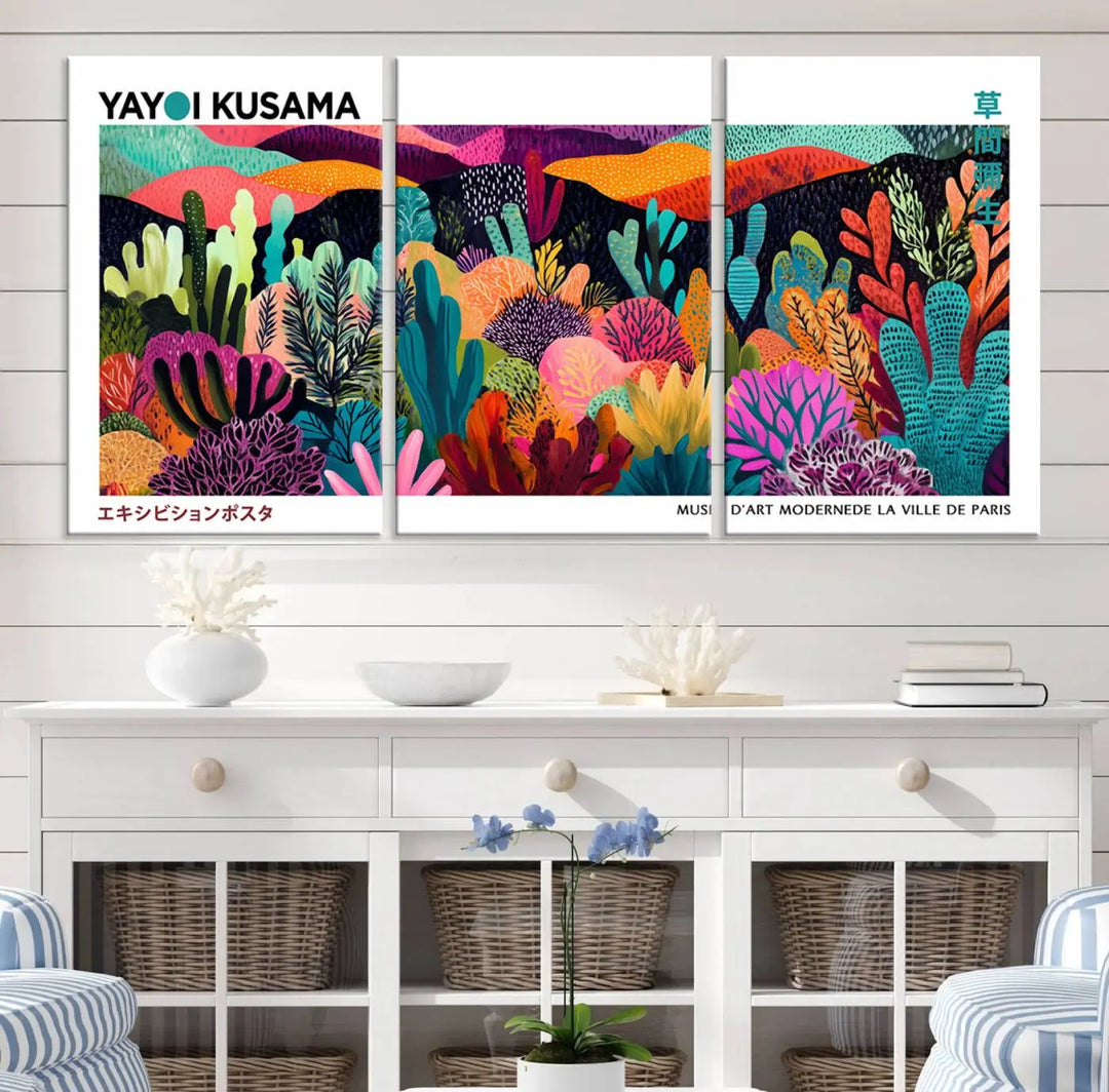 A cozy living room features colorful wall art, with the Framed Yayoi Kusama 1986 Wall Art Print taking center stage. This vibrant abstract landscape canvas seamlessly blends with the contemporary décor, creating a lively yet harmonious atmosphere.