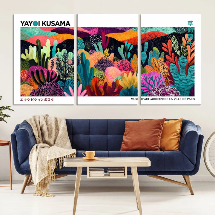 A cozy living room features colorful wall art, with the Framed Yayoi Kusama 1986 Wall Art Print taking center stage. This vibrant abstract landscape canvas seamlessly blends with the contemporary décor, creating a lively yet harmonious atmosphere.