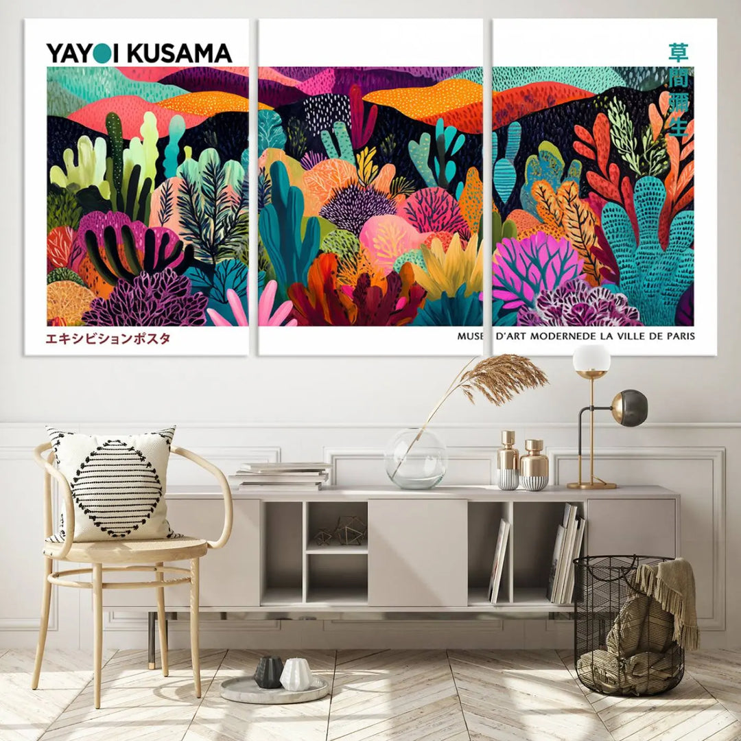 A cozy living room features colorful wall art, with the Framed Yayoi Kusama 1986 Wall Art Print taking center stage. This vibrant abstract landscape canvas seamlessly blends with the contemporary décor, creating a lively yet harmonious atmosphere.