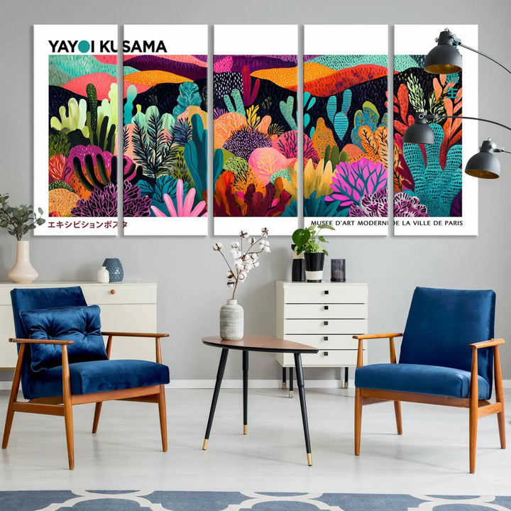 A cozy living room features colorful wall art, with the Framed Yayoi Kusama 1986 Wall Art Print taking center stage. This vibrant abstract landscape canvas seamlessly blends with the contemporary décor, creating a lively yet harmonious atmosphere.