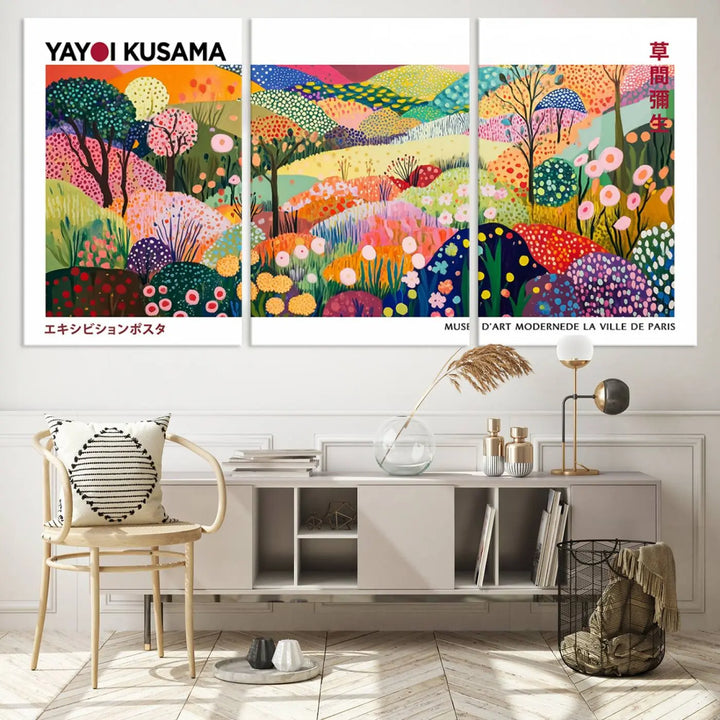 Three vibrant, abstract Yayoi Kusama wall art prints adorn a black wall, creating a perfect blend of contemporary décor.