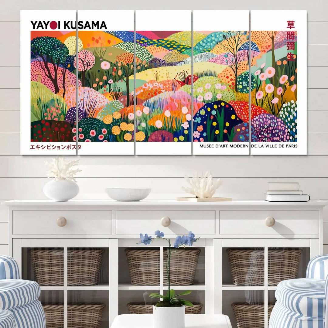 Three vibrant, abstract Yayoi Kusama wall art prints adorn a black wall, creating a perfect blend of contemporary décor.