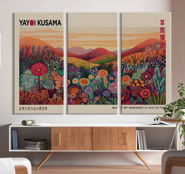 The room is adorned with a triptych artwork depicting colorful flowers and hills, incorporating the "Framed Yayoi Kusama 1986 Wall Art Print" – a vibrant abstract landscape canvas print that blends Japanese Wabi Sabi themes into contemporary nature-inspired décor.