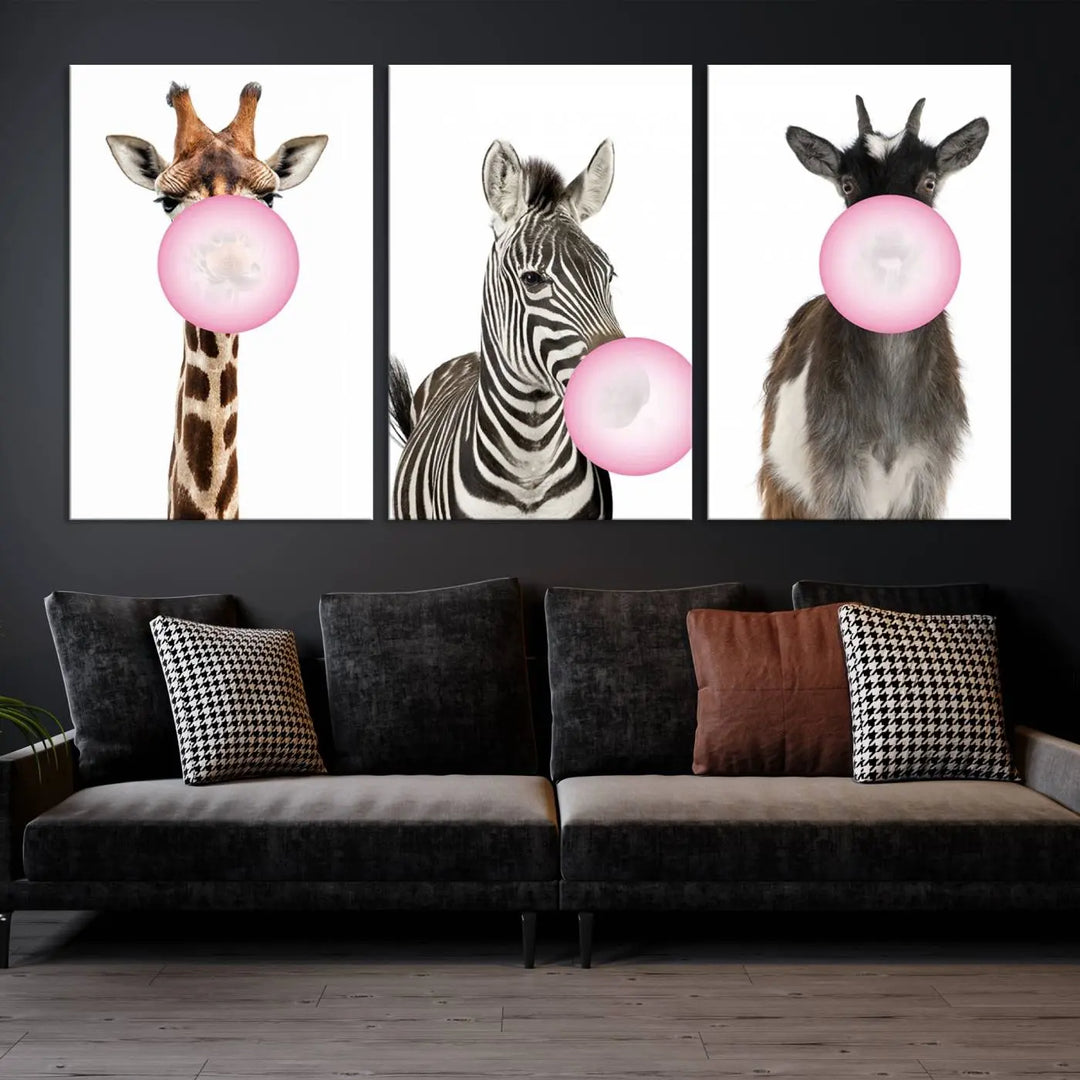 The "Funny Animals Canvas Wall Art Goat Zebra Giraffe Canvas Print" features a giraffe, zebra, and goat blowing pink bubblegum on museum-quality canvas, adding a playful touch to the space.