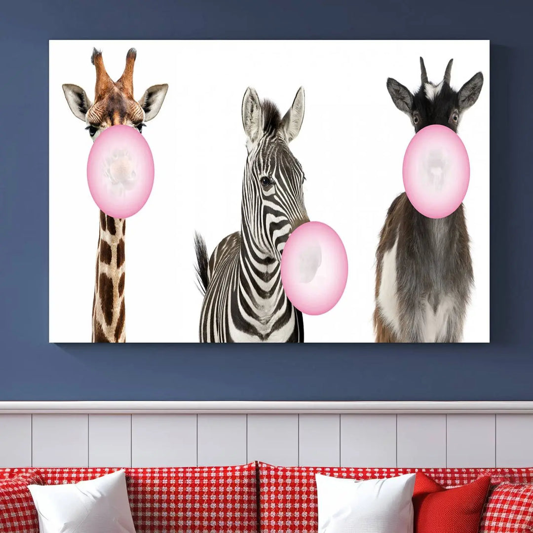 The "Funny Animals Canvas Wall Art Goat Zebra Giraffe Canvas Print" features a giraffe, zebra, and goat blowing pink bubblegum on museum-quality canvas, adding a playful touch to the space.