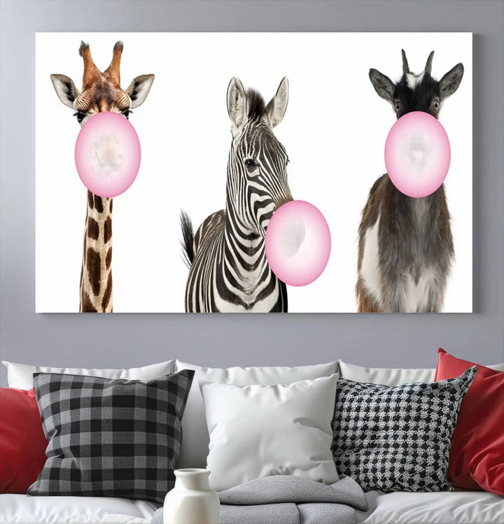 The "Funny Animals Canvas Wall Art Goat Zebra Giraffe Canvas Print" features a giraffe, zebra, and goat blowing pink bubblegum on museum-quality canvas, adding a playful touch to the space.