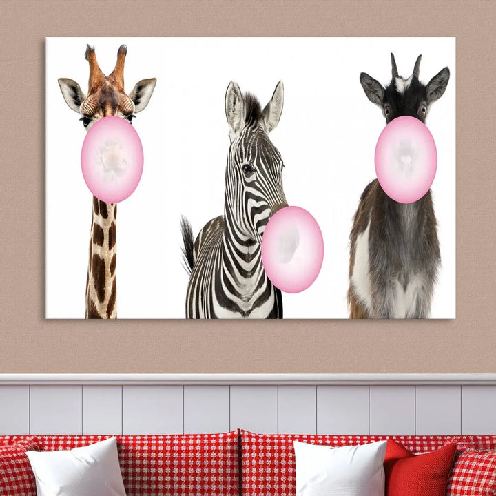 The "Funny Animals Canvas Wall Art Goat Zebra Giraffe Canvas Print" features a giraffe, zebra, and goat blowing pink bubblegum on museum-quality canvas, adding a playful touch to the space.