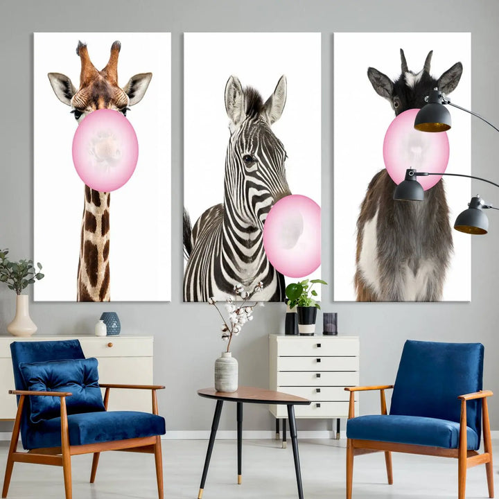 The "Funny Animals Canvas Wall Art Goat Zebra Giraffe Canvas Print" features a giraffe, zebra, and goat blowing pink bubblegum on museum-quality canvas, adding a playful touch to the space.