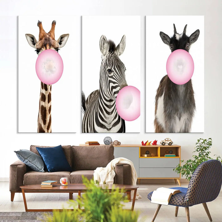 The "Funny Animals Canvas Wall Art Goat Zebra Giraffe Canvas Print" features a giraffe, zebra, and goat blowing pink bubblegum on museum-quality canvas, adding a playful touch to the space.