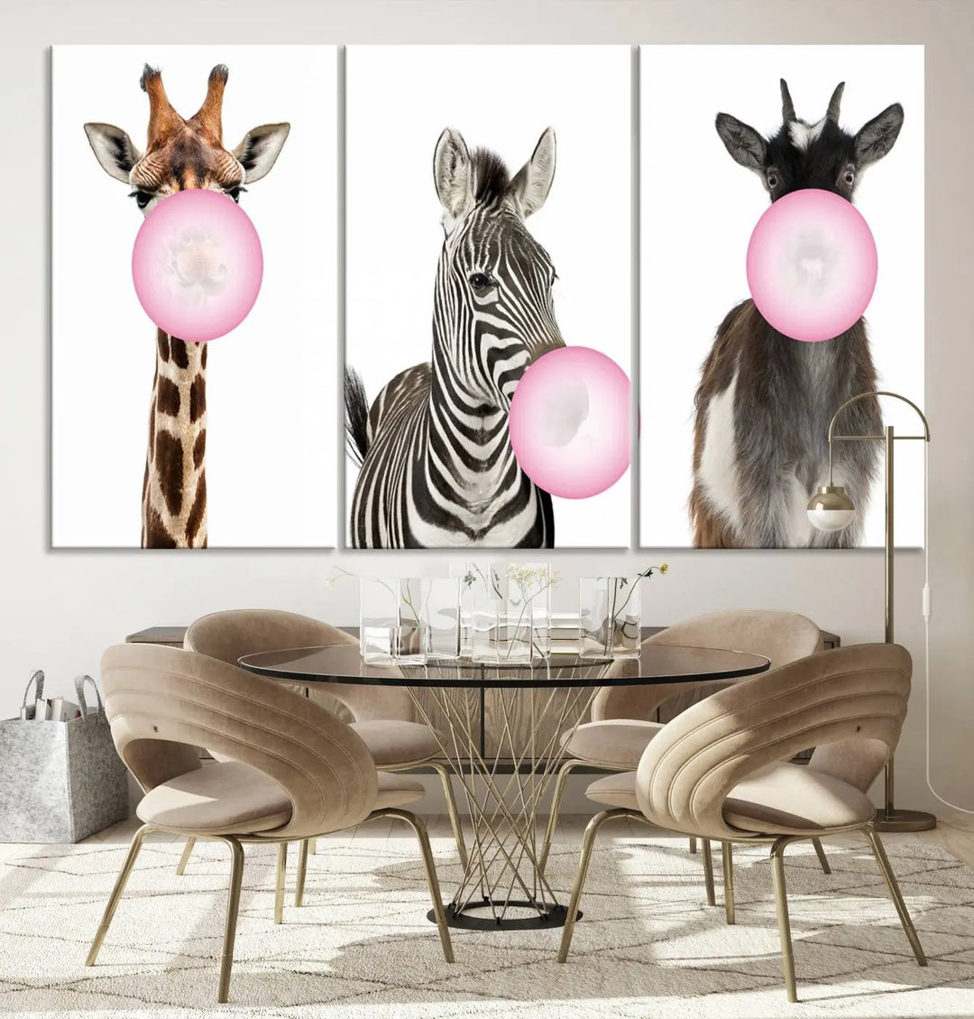 The "Funny Animals Canvas Wall Art Goat Zebra Giraffe Canvas Print" features a giraffe, zebra, and goat blowing pink bubblegum on museum-quality canvas, adding a playful touch to the space.